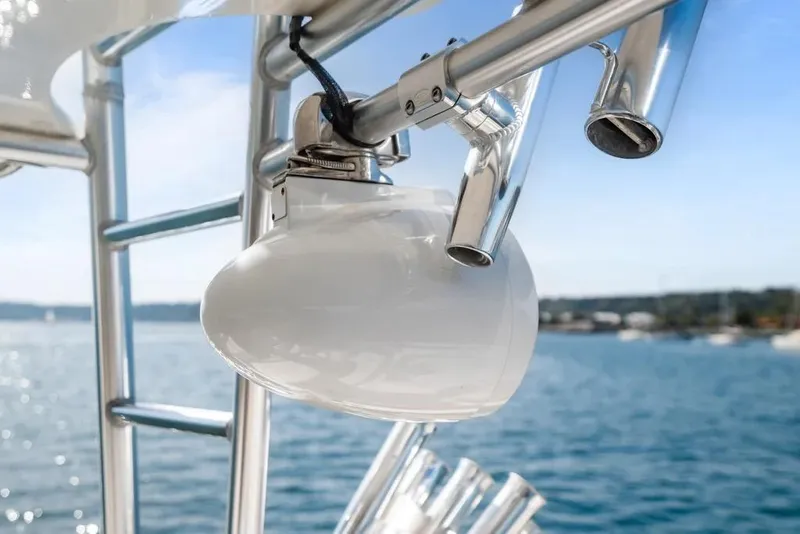 Slide: The Image of Close-up of 2003 Cabo 35 Express boat's fishing rod holder and light fixture. - 15