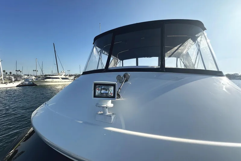 Slide: The Image of 2008 Silverton 36 Convertible yacht docked in a sunny marina. - 10