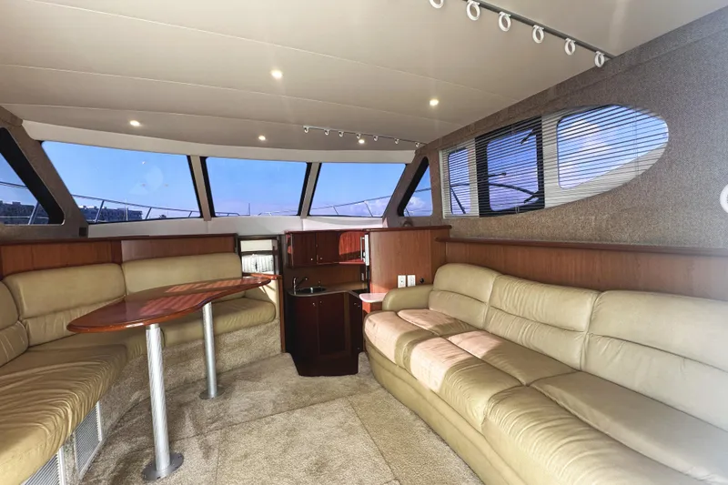 Slide: The Image of Luxurious interior of 2008 Silverton 36 Convertible yacht with plush seating and elegant design. - 11