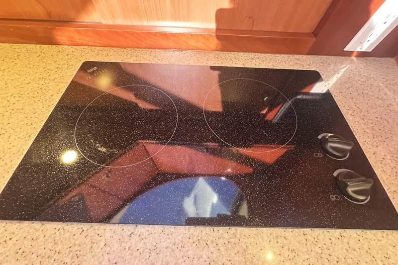 Slide: The Image of Ceramic cooktop on 2008 Silverton 36 Convertible yacht kitchen counter. - 15