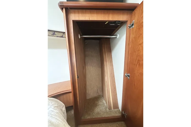 Slide: The Image of Wooden closet interior on 2008 Silverton 36 Convertible boat. - 18