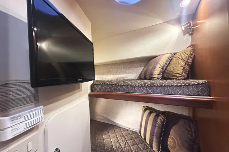 Slide: The Image of Interior of 2008 Silverton 36 Convertible yacht with bunk beds and wall-mounted TV. - 20