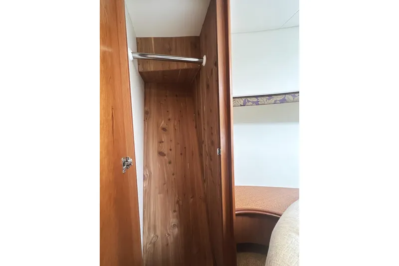 Slide: The Image of 2008 Silverton 36 Convertible interior with wooden closet and cozy cabin space. - 24