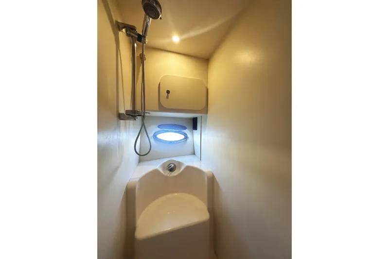 Slide: The Image of Compact bathroom with shower in 2008 Silverton 36 Convertible yacht. - 26