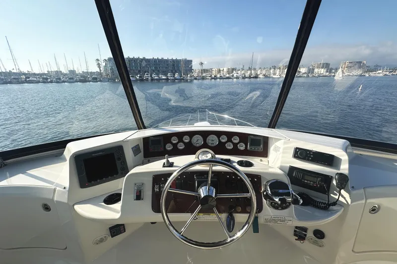 Slide: The Image of Helm of 2008 Silverton 36 Convertible yacht with marina view. - 28