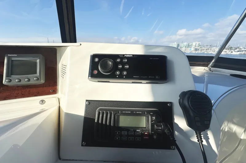 Slide: The Image of Control panel of a 2008 Silverton 36 Convertible boat with navigation and communication equipment. - 30