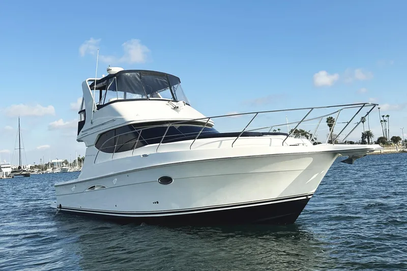 Slide: The Image of 2008 Silverton 36 Convertible yacht on calm water, clear sky background. - 8