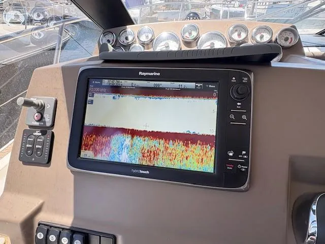 Slide: The Image of Dashboard of 2013 Jeanneau NC11 with Raymarine navigation display and controls. - 7