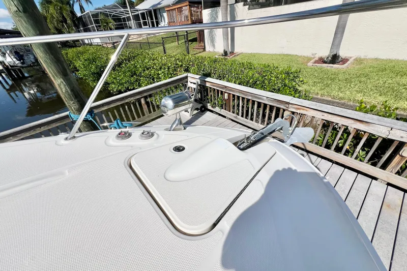 Slide: The Image of 2012 Sea Ray 310 Sundancer boat deck with anchor and railing. - 20