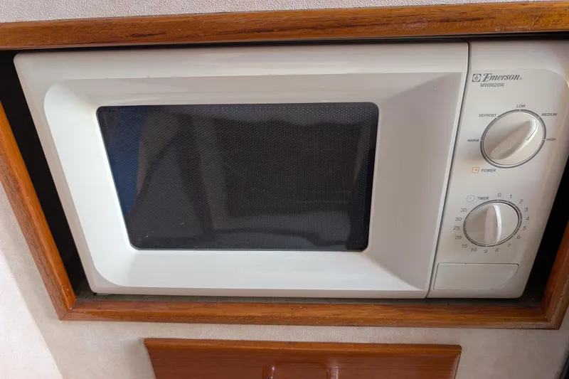 Slide: The Image of Emerson microwave in 1989 Blackman Billfisher 26 boat kitchen setup. - 24