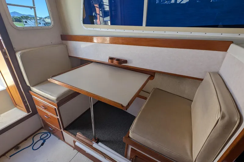 Slide: The Image of Interior of 1989 Blackman Billfisher 26 boat with seating and table setup. - 3
