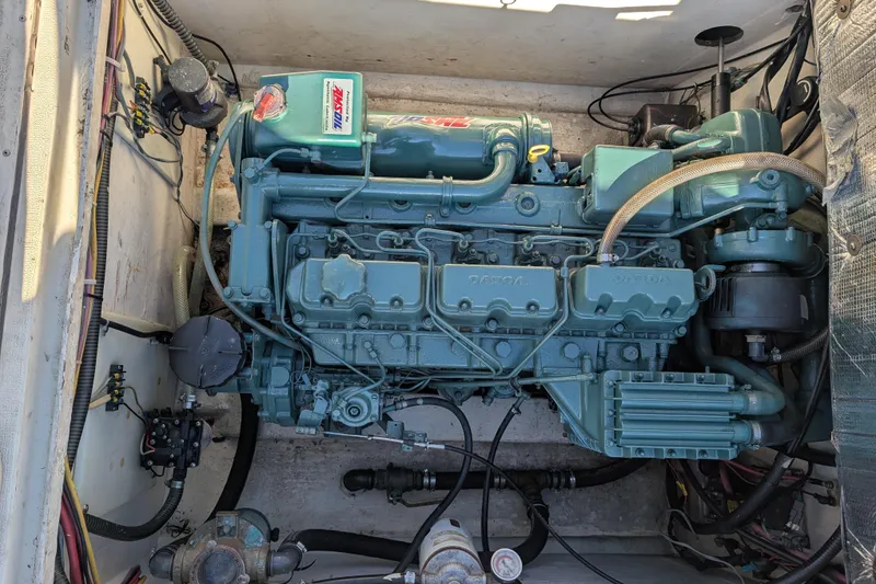 Slide: The Image of Engine compartment of a 1989 Blackman Billfisher 26 boat, showcasing detailed machinery. - 4