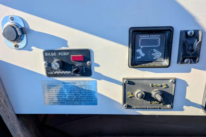Slide: The Image of Control panel of a 1989 Blackman Billfisher 26 boat with bilge pump and Volvo Penta gauge. - 41