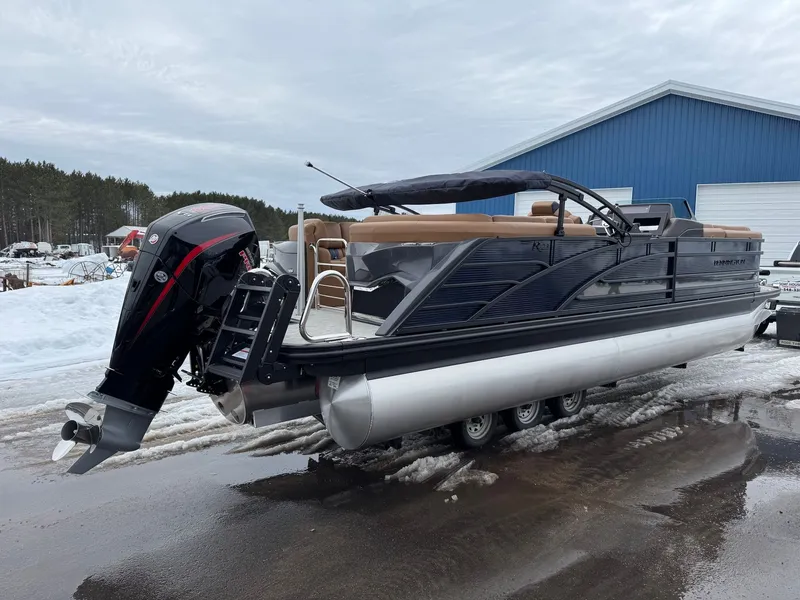 Slide: The Image of 2026 Bennington 23RFB ESP TRI pontoon boat parked in snow. - 14