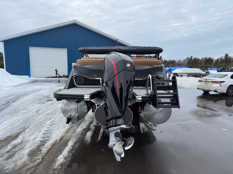 Slide: The Image of 2026 Bennington 23RFB ESP TRI boat parked outdoors. - 15