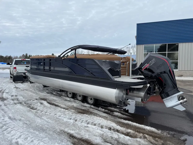 Slide: The Image of Bennington 23RFB ESP TRI 2026 on trailer in snow. - 16