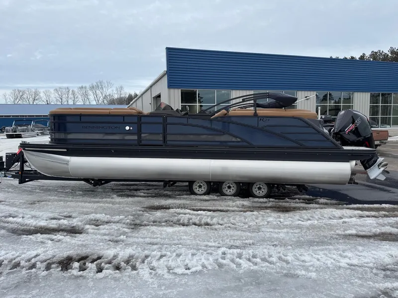 Slide: The Image of 2026 Bennington 23RFB ESP TRI pontoon boat on snowy parking lot. - 17
