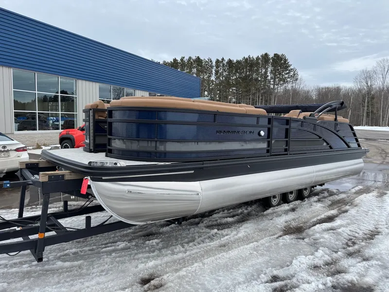 Slide: The Image of 2026 Bennington 23RFB ESP TRI pontoon boat parked in snow. - 18