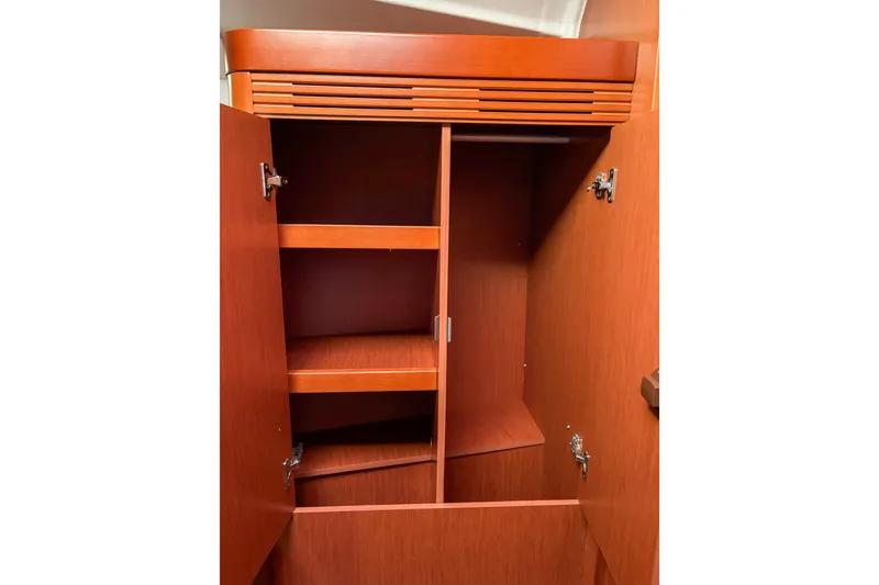 Slide: The Image of Wooden cabinet interior on a 2015 Beneteau Oceanis 37 sailboat. - 10