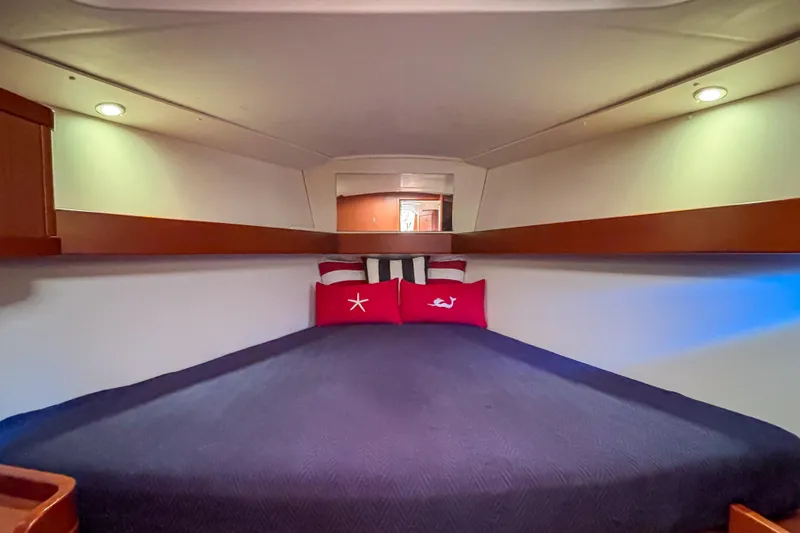 Slide: The Image of Cozy cabin interior of 2015 Beneteau Oceanis 37 sailboat with plush bedding. - 12