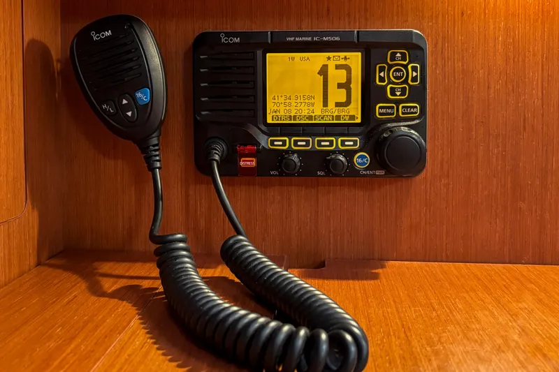 Slide: The Image of VHF marine radio on 2015 Beneteau Oceanis 37 yacht, featuring Icom IC-M506 model. - 16