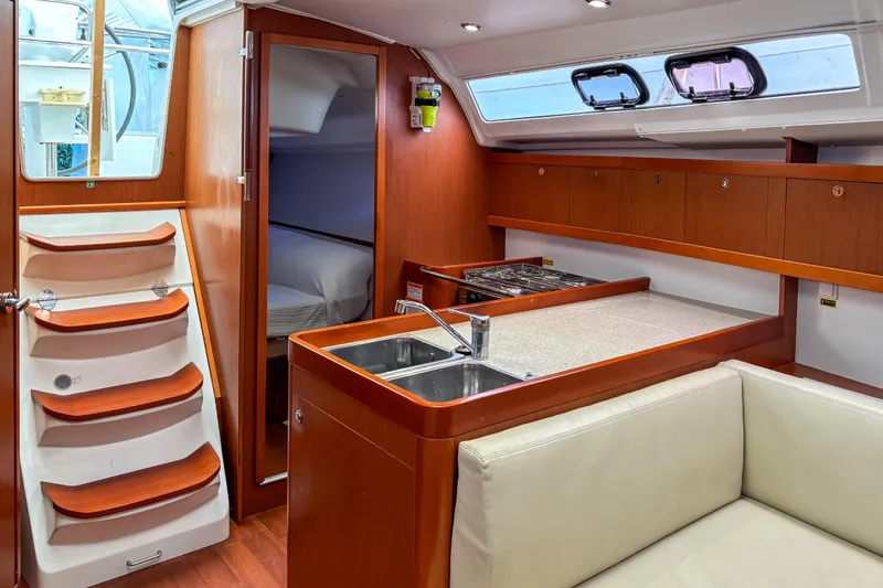 Slide: The Image of Interior of 2015 Beneteau Oceanis 37 yacht with modern kitchen and cozy cabin. - 18