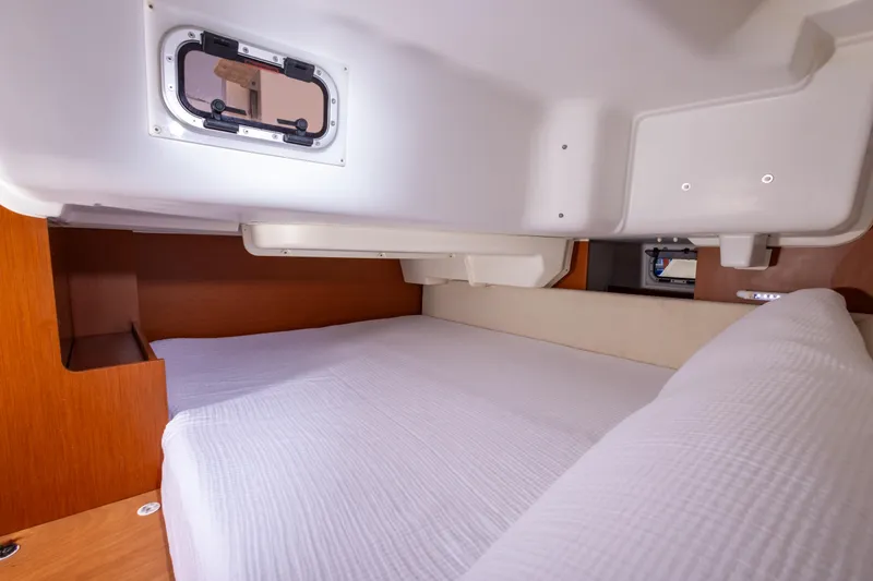 Slide: The Image of Cozy cabin interior of 2015 Beneteau Oceanis 37 sailboat with comfortable bedding. - 20