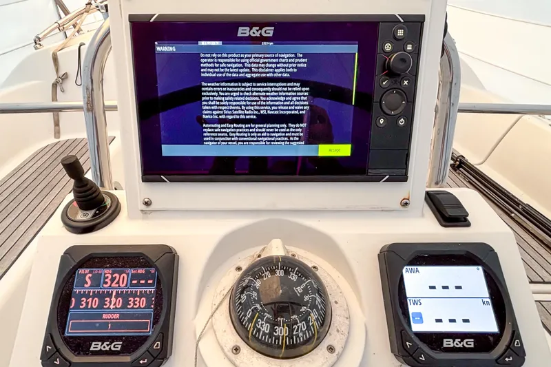 Slide: The Image of Cockpit navigation instruments on a 2015 Beneteau Oceanis 37 sailboat. - 7