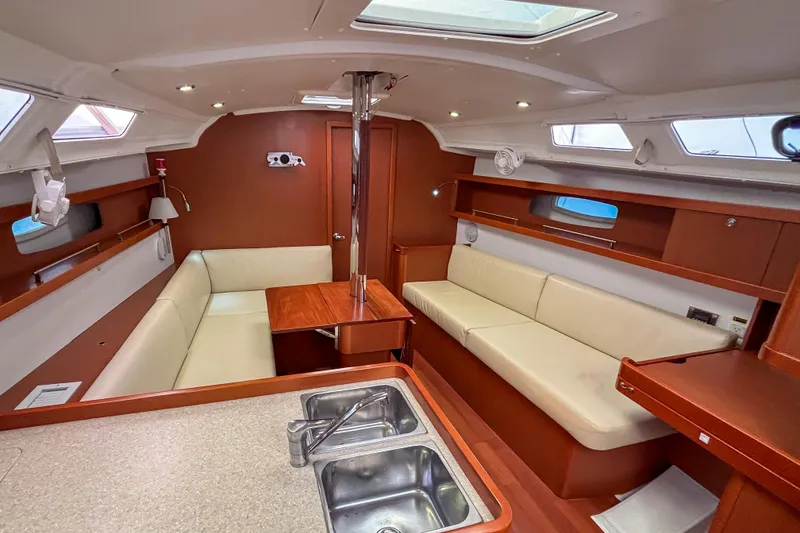Slide: The Image of Interior of 2015 Beneteau Oceanis 37 sailboat with cozy seating and modern design. - 8