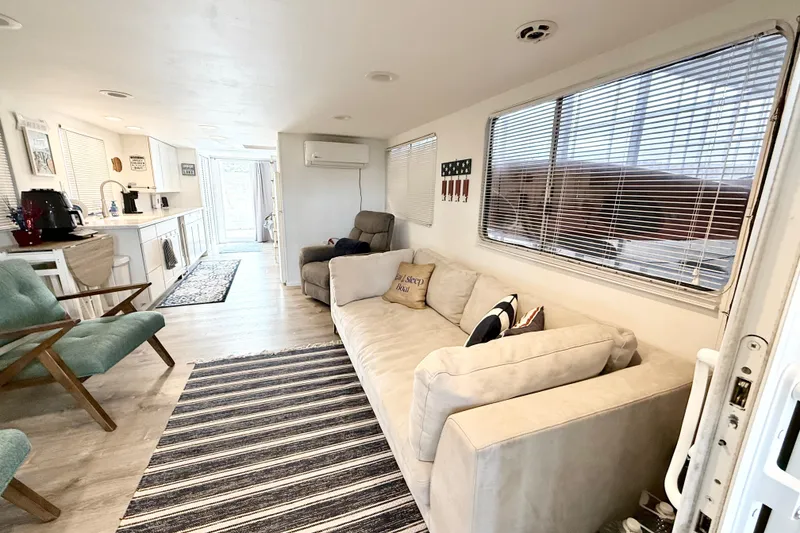 Slide: The Image of Interior of 1985 Three Buoys 42 Sport Cruiser HB with modern furnishings and cozy seating. - 3