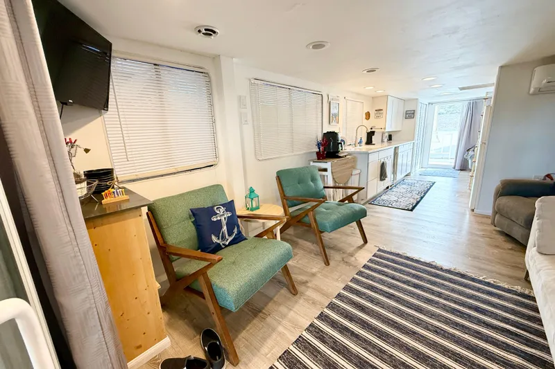 Slide: The Image of Interior of 1985 Three Buoys 42 Sport Cruiser HB with modern decor and seating area. - 4