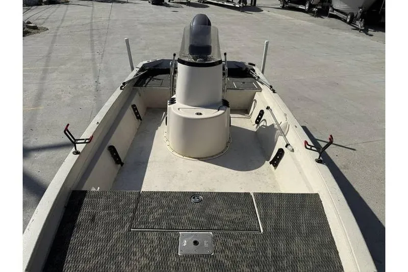 Slide: The Image of 2009 Express HD20 boat interior with console and fishing rod holders. - 10