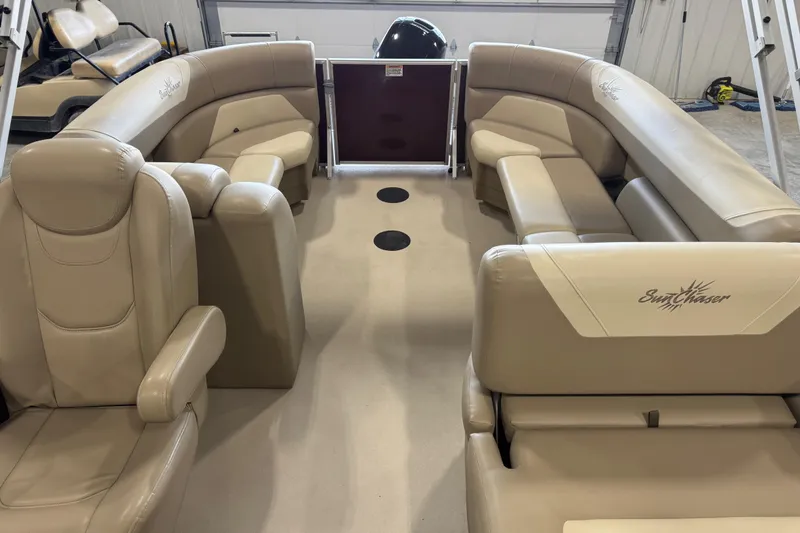 Slide: The Image of 2022 SunChaser Geneva Cruise 24 CRS interior with beige seating and spacious layout. - 14