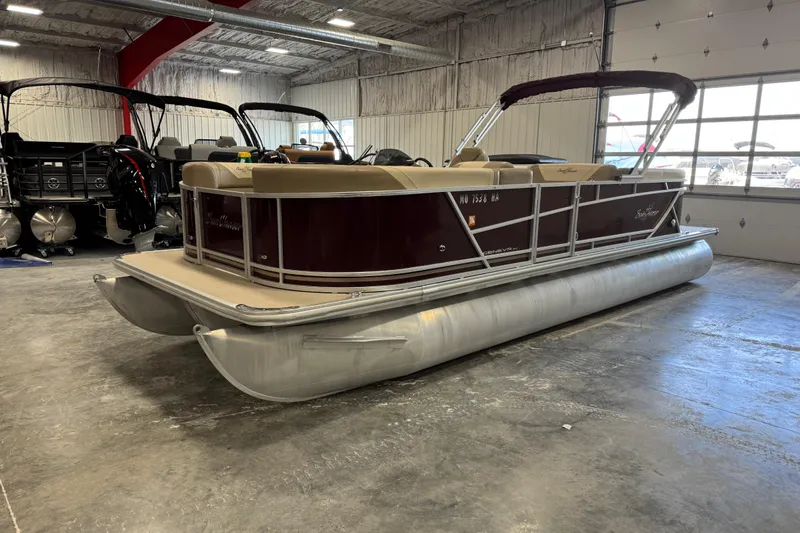 Slide: The Image of 2022 SunChaser Geneva Cruise 24 CRS pontoon boat in a showroom setting. - 5