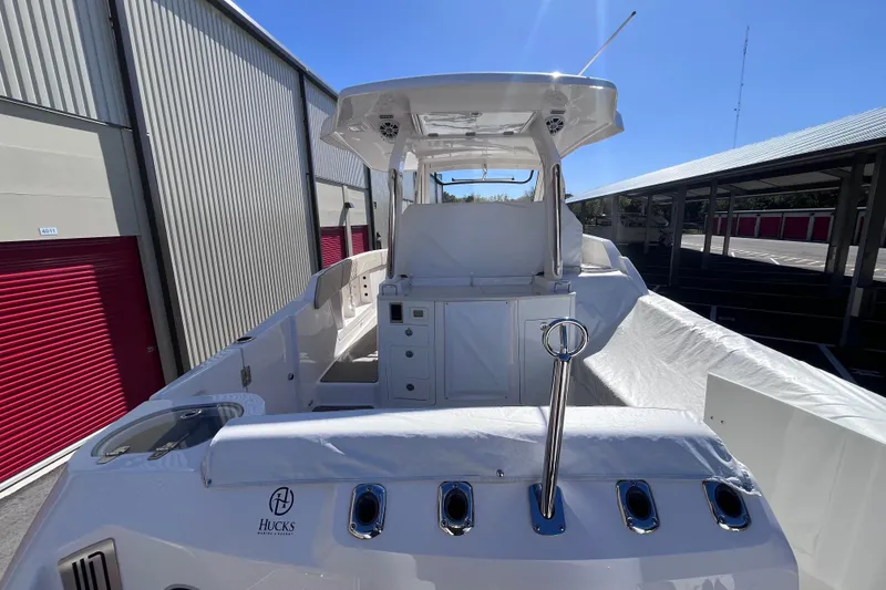 Slide: The Image of 2019 Regal 33 SAV boat docked, featuring sleek design and modern amenities. - 11