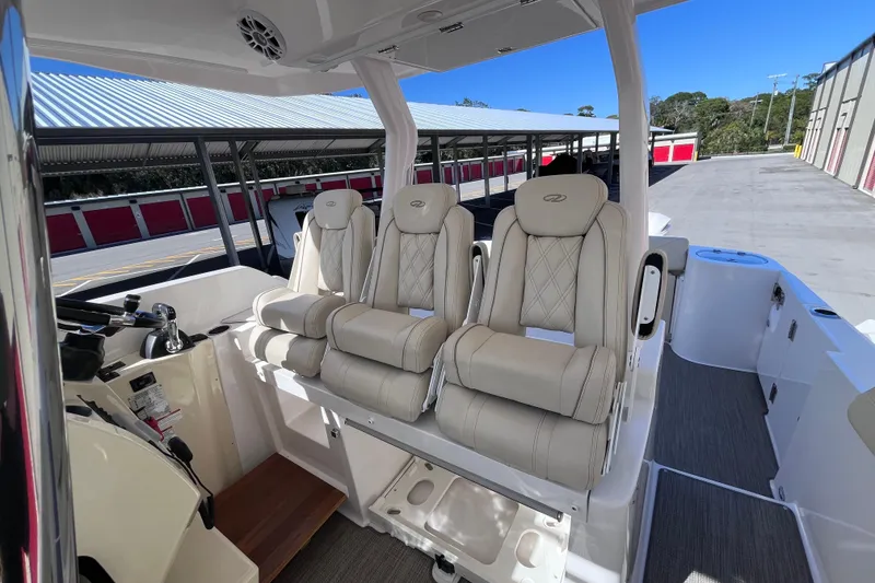 Slide: The Image of 2019 Regal 33 SAV boat interior with luxurious seating and modern design. - 24