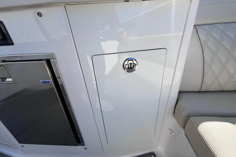 Slide: The Image of 2019 Regal 33 SAV interior with storage compartment and seating detail. - 49