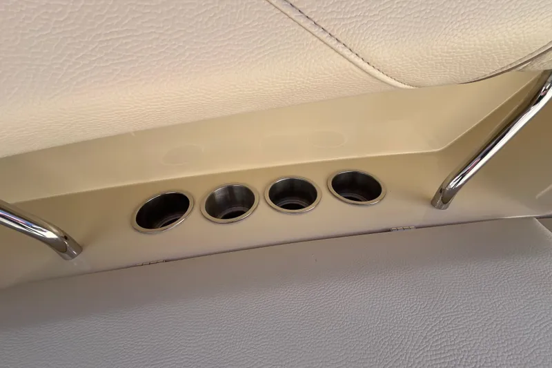 Slide: The Image of 2019 Regal 33 SAV interior with cup holders and chrome accents. - 58