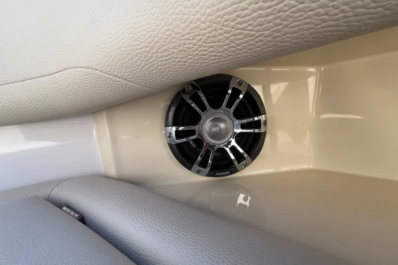 Slide: The Image of Speaker in 2019 Regal 33 SAV boat interior, featuring beige leather upholstery. - 59