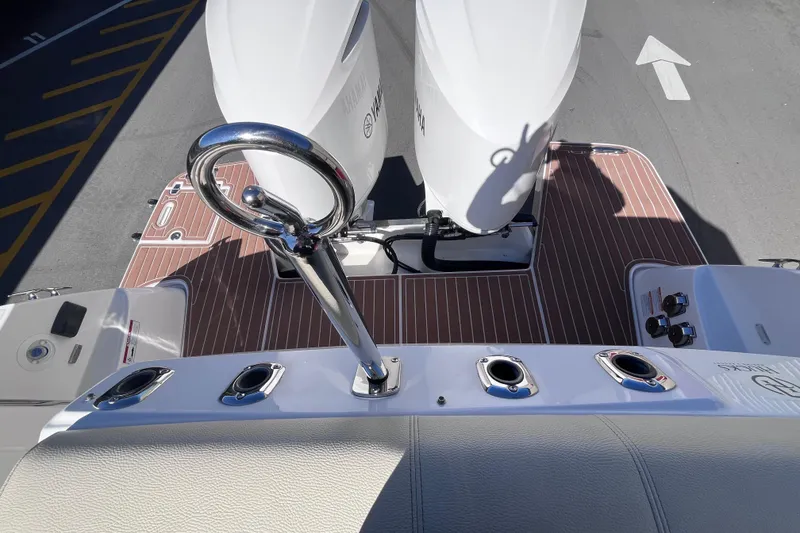 Slide: The Image of 2019 Regal 33 SAV boat deck with Yamaha engines and polished railing. - 65