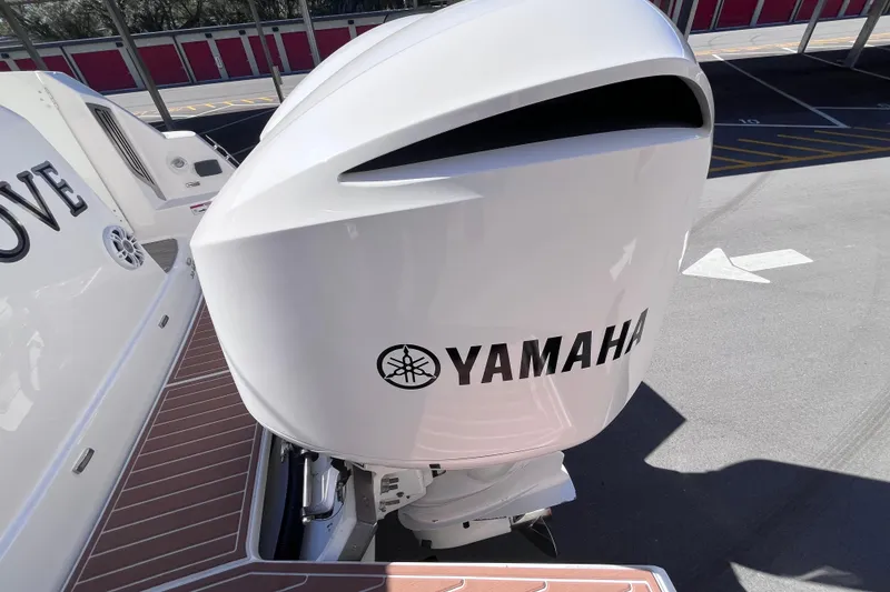 Slide: The Image of 2019 Regal 33 SAV boat with Yamaha outboard motor in a parking area. - 66