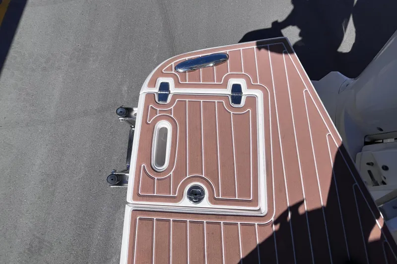 Slide: The Image of 2019 Regal 33 SAV boat deck with brown and white pattern. - 68