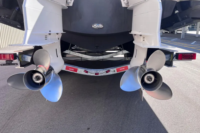 Slide: The Image of 2019 Regal 33 SAV boat with dual propellers on a trailer. - 72