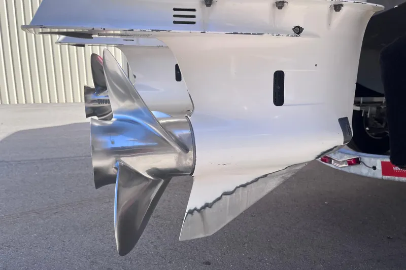 Slide: The Image of Close-up of a 2019 Regal 33 SAV boat propeller in a marina setting. - 75