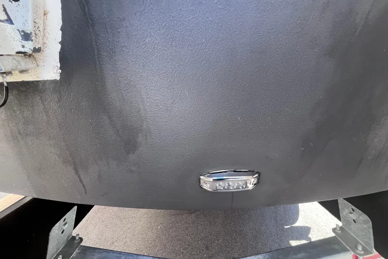 Slide: The Image of 2019 Regal 33 SAV boat hull with mounted light fixture. - 77