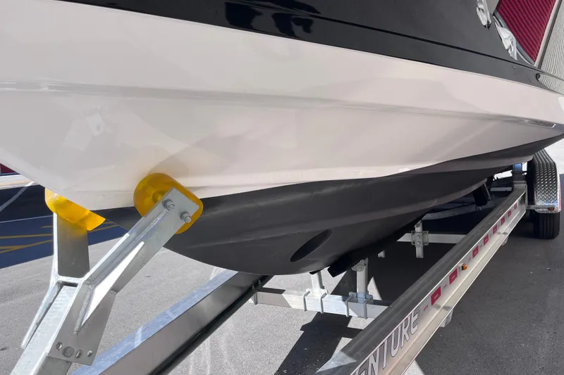 Slide: The Image of 2019 Regal 33 SAV boat on trailer, close-up of hull and support. - 8