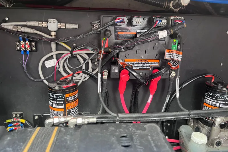 Slide: The Image of 2019 Regal 33 SAV hydraulic steering system with wiring and pump components. - 83