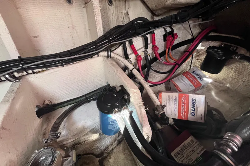 Slide: The Image of Engine compartment of 2019 Regal 33 SAV with wiring and Sierra filters. - 89