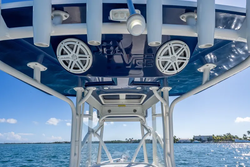 Slide: The Image of 2017 SeaVee 270Z boat with JL Audio speakers and rod holders, ocean view. - 12