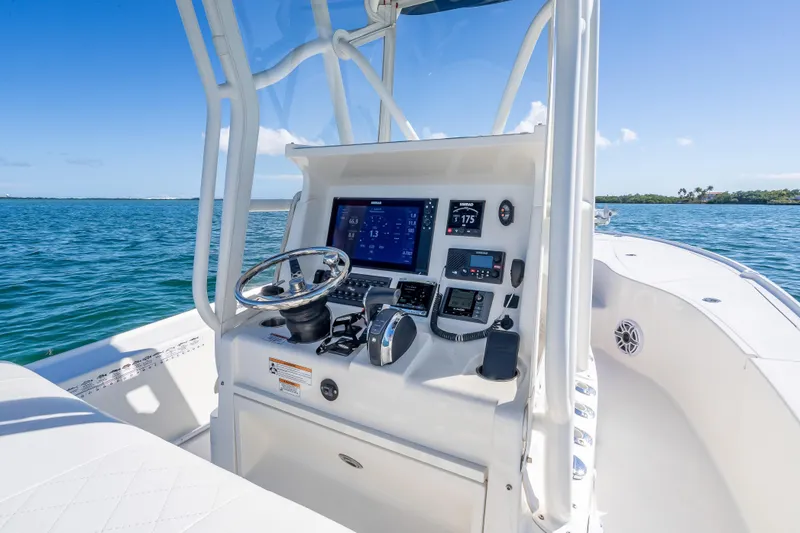 Slide: The Image of 2017 SeaVee 270Z boat dashboard with navigation controls on open water. - 5